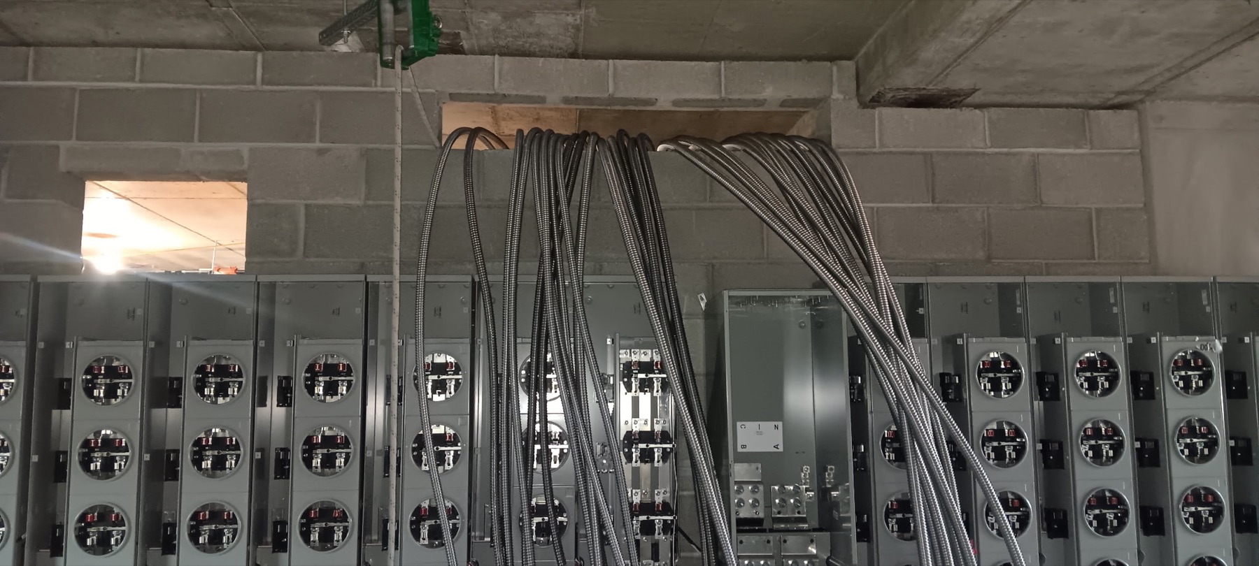 Meter banks and bundled metal conduit during construction