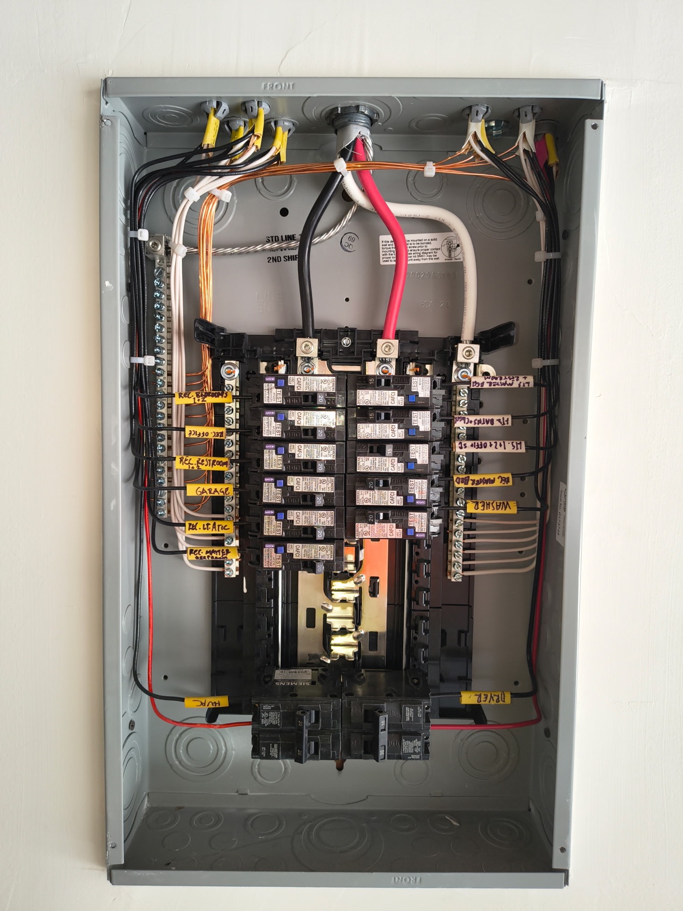 Residential branch circuit panel labeled by room and equipment
